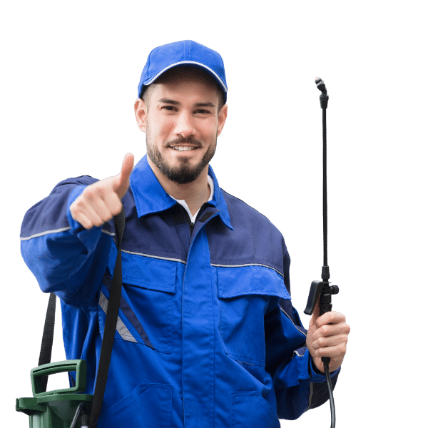 a person wearing a blue hat and blue overalls holding a spray gun